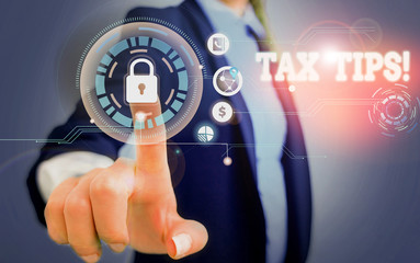 Word writing text Tax Tips. Business photo showcasing compulsory contribution to state revenue levied by government Woman wear formal work suit present presentation using smart latest device