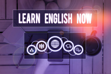 Handwriting text writing Learn English Now. Conceptual photo gain or acquire knowledge and skill of...