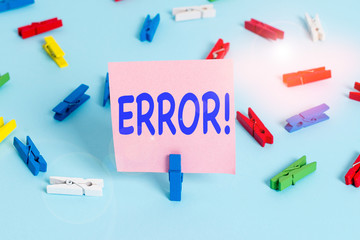 Text sign showing Error. Business photo showcasing state or condition of being wrong in conduct judgement or program Colored clothespin papers empty reminder blue floor background office pin