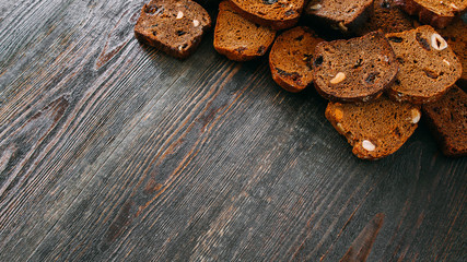 Homemade bread recipe. Brown rustic wooden background.