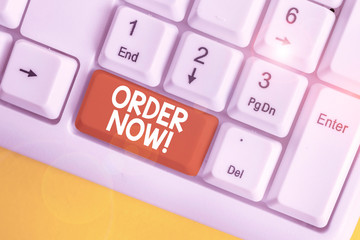 Text sign showing Order Now. Business photo text confirmed request by one party to another to buy sell White pc keyboard with empty note paper above white background key copy space