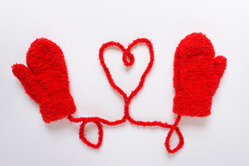 Red winter mittens with heart shape