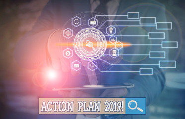 Conceptual hand writing showing Action Plan 2019. Concept meaning proposed strategy or course of actions for current year Picture photo network scheme with modern smart device