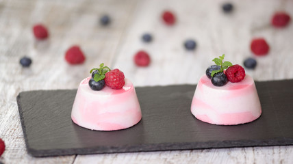 Delicious mousse dessert with fresh berries and mint.