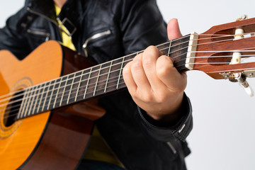 Fototapeta na wymiar Redhead woman playing guitar