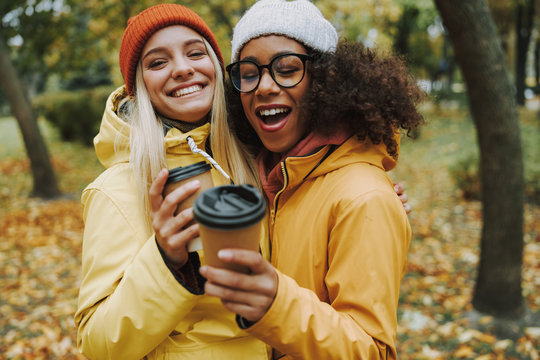 Two young females walking in park together