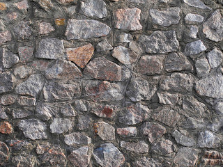 Stonework granite wall closeup. Natural background.      