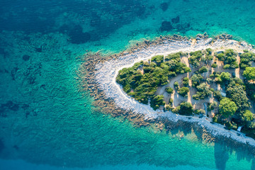Plakat Aerial view of sea and beach in a lagoon on Cres ( isola Cherso ) Island Croatia, close to Punta Kriza ( Punta Croce ). It is a part of national where rocks and sand and forest merge on a coast. 