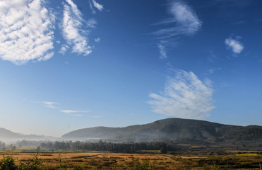 landscape with mountains and clouds