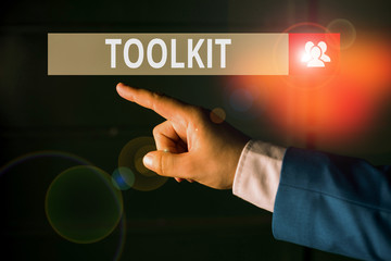 Conceptual hand writing showing Toolkit. Concept meaning set of tools kept in a bag or box and used for a particular purpose Isolated hand pointing with finger. Business concept