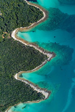 Aerial view of sea and beach in a lagoon on Cres ( isola Cherso )  Island Croatia, close to Punta Kriza ( Punta Croce ). It is a part of national where rocks and sand and forest merge on a coast. 