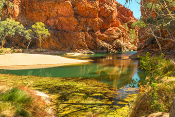 Permanent waterhole Ellery Creek Big Hole and geological site with red cliffs in West MacDonnell National Park, 80km from Alice Springs, Northern Territory, Central Australia. Australian outback.