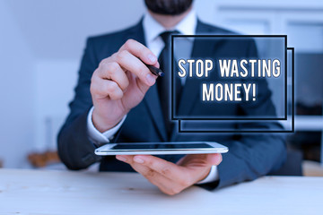 Conceptual hand writing showing Stop Wasting Money. Concept meaning advicing demonstrating or group to start saving and use it wisely Male human wear formal clothes present use hitech smartphone