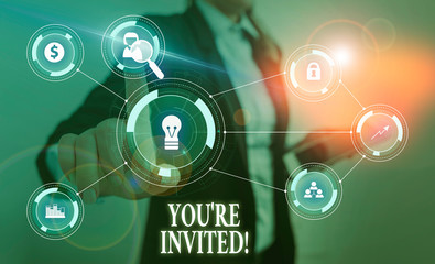 Text sign showing You Re Invited. Business photo text make a polite friendly request to someone go somewhere Woman wear formal work suit presenting presentation using smart device