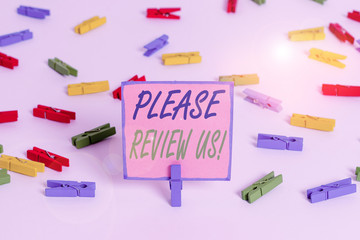 Text sign showing Please Review Us. Business photo text situation or system is formal examination by showing authority Colored clothespin papers empty reminder white floor background office
