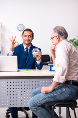 Financial advisor giving retirement advice to old man