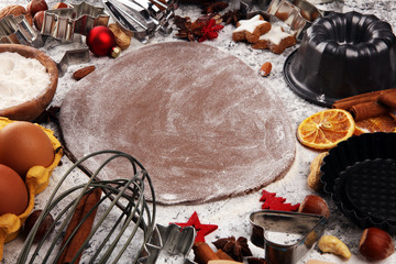 Baking christmas cookies. Typical cinnamon stars bakery with spices. xmas decoration on table