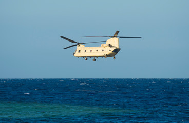 Military chinook helicopter in flight
