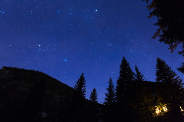 Fototapeta na wymiar Night sky with stars at Dolomites mountains, Italy