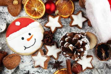Christmas cookies and spices on rustic background with decoration