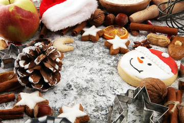 Christmas cookies and spices on rustic background with decoration