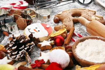 Christmas cookies and spices on rustic background with decoration