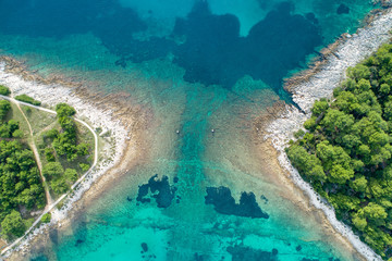 Vertical aerial image of motor boat passing strait close to the coast on the island of Losinj ( Cres ), Croatia. 