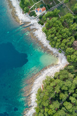 Vertical aerial image of motor boat passing strait close to the coast on the island of Losinj ( Cres ), Croatia. 