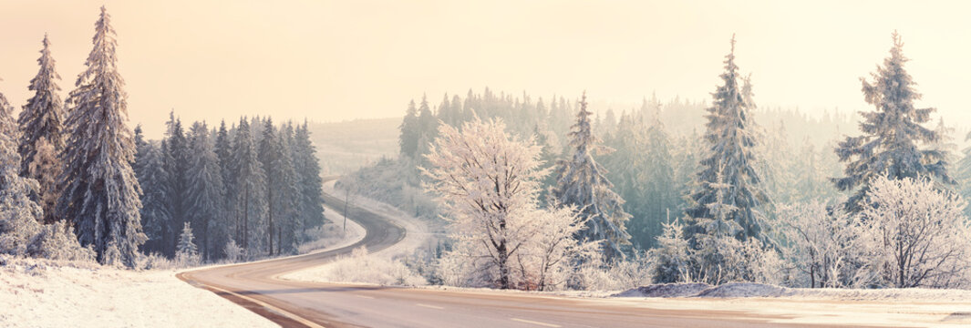 Winter landscape at morning light, sunny morning. Empty road