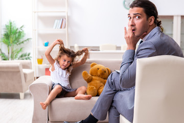 Child psychologist attending small girl