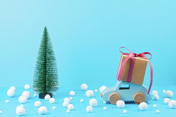 Christmas decoration with wooden car, pine tree, with copy space. Season greeting card
