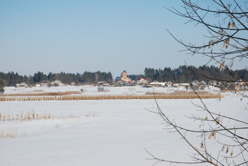 Fototapeta premium Winter landscape with snow covered countryside. European winter landscape.