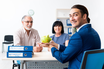 Financial advisor giving retirement advice to old couple