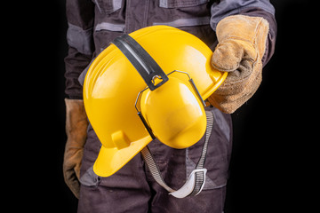 Employee in safety clothing with helmet. Safety accessories for workers.