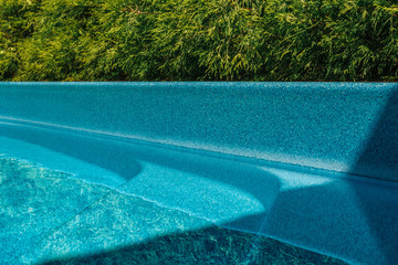 Part of the pool close-up, abstract geometry of the pool, fragments and details of the pool, pool bowl, top view, shape, lines.
