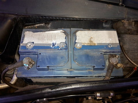 Old battery, plugged in and embedded in the car