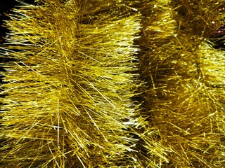 Beautiful tinsel, great design for any purposes. New year card. Bright tinsel, Christmas background, shiny pattern. Colorful decoration.