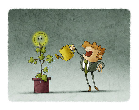 Businessman is watering a plant from which a light bulb blooms.