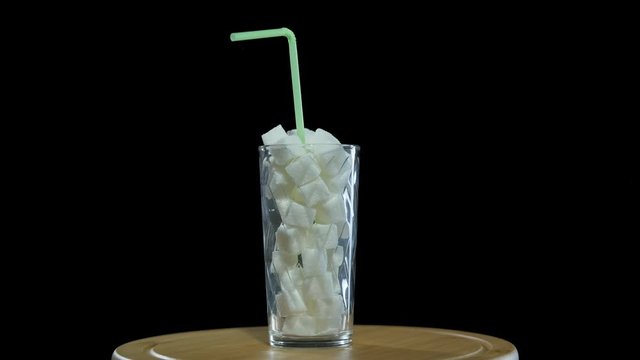 Put sugar in the glass.