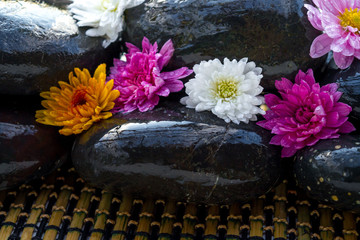 Black stones and flowers