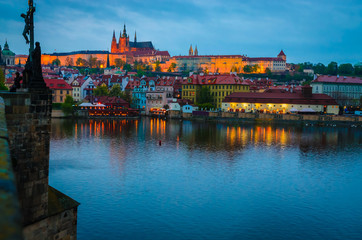 Old Town architecture and  Vltava river at night in Prague, Czech Republic.