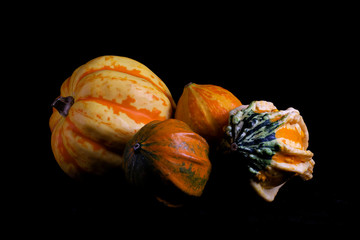 ornamental gourds on black background