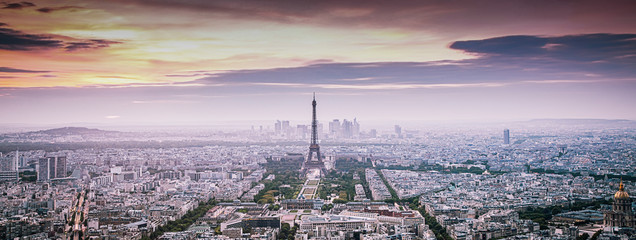 aerial view over Paris at sunset with iconic Eiffel tower