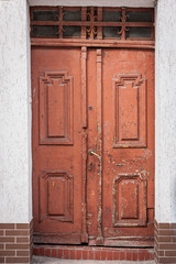 Old wooden weathered brown front door