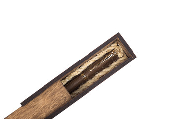 Beautiful wooden box with ballpoint pen inside on a white background.