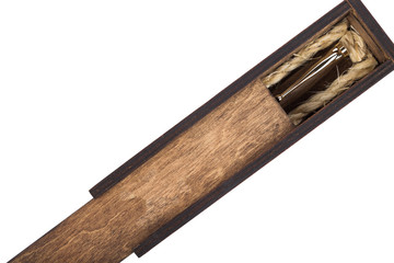 Beautiful wooden box with ballpoint pen inside on a white background.