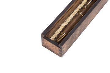 Beautiful wooden box with ballpoint pen inside on a white background.