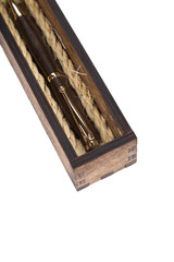 Beautiful wooden box with ballpoint pen inside on a white background.