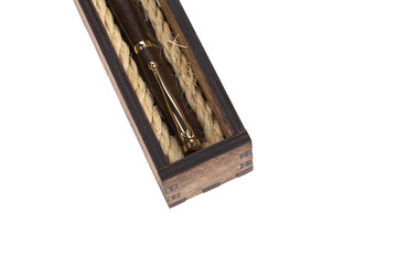 Beautiful wooden box with ballpoint pen inside on a white background.