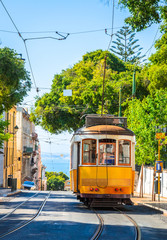 Obraz premium Famous vintage tram in the street of Alfama, Lisbon, Portugal